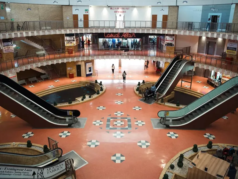 Inside the Grand Bazaar: the circular atrium with escalators and a patterned floor