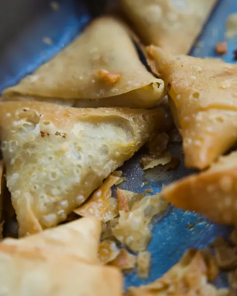 Close-up of freshly fried samoosas